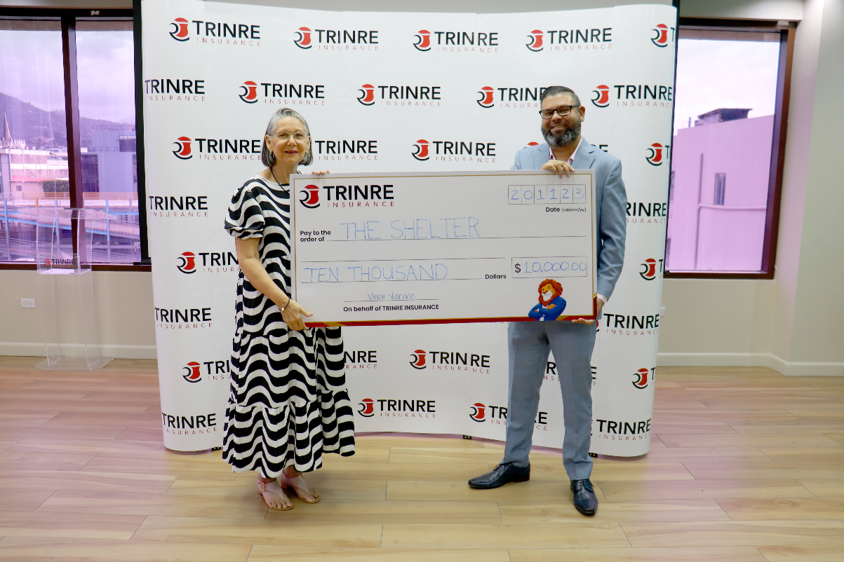 TRINRE’s Marketing and Customer Experience Manager - Mr. Vinai Narace makes a donation to The Shelter’s Vice Chairman Mrs. Sherron Harford.